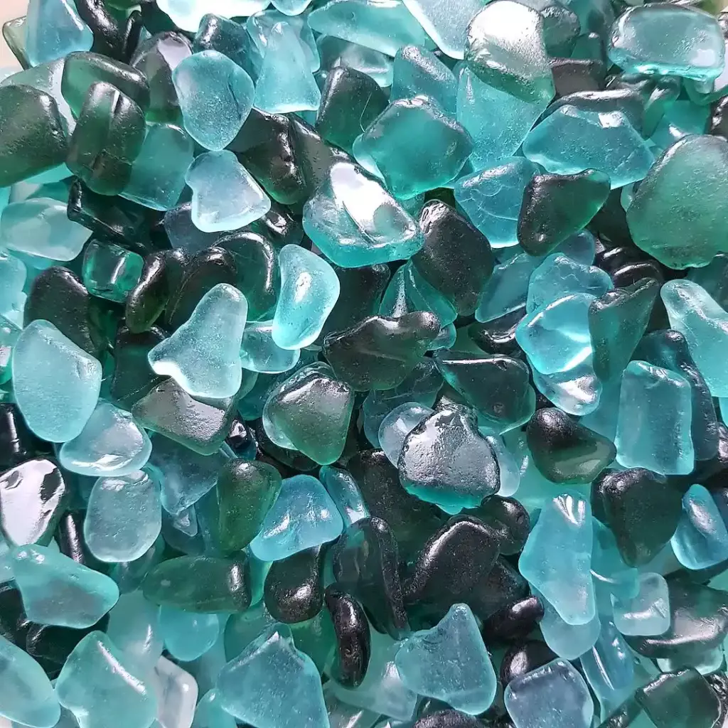 A gorgeous display of small sea glass pieces of teal color