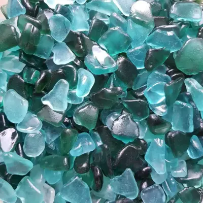 A gorgeous display of small sea glass pieces of teal color