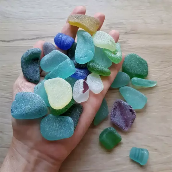 Handful of frosty sea glass of different colors