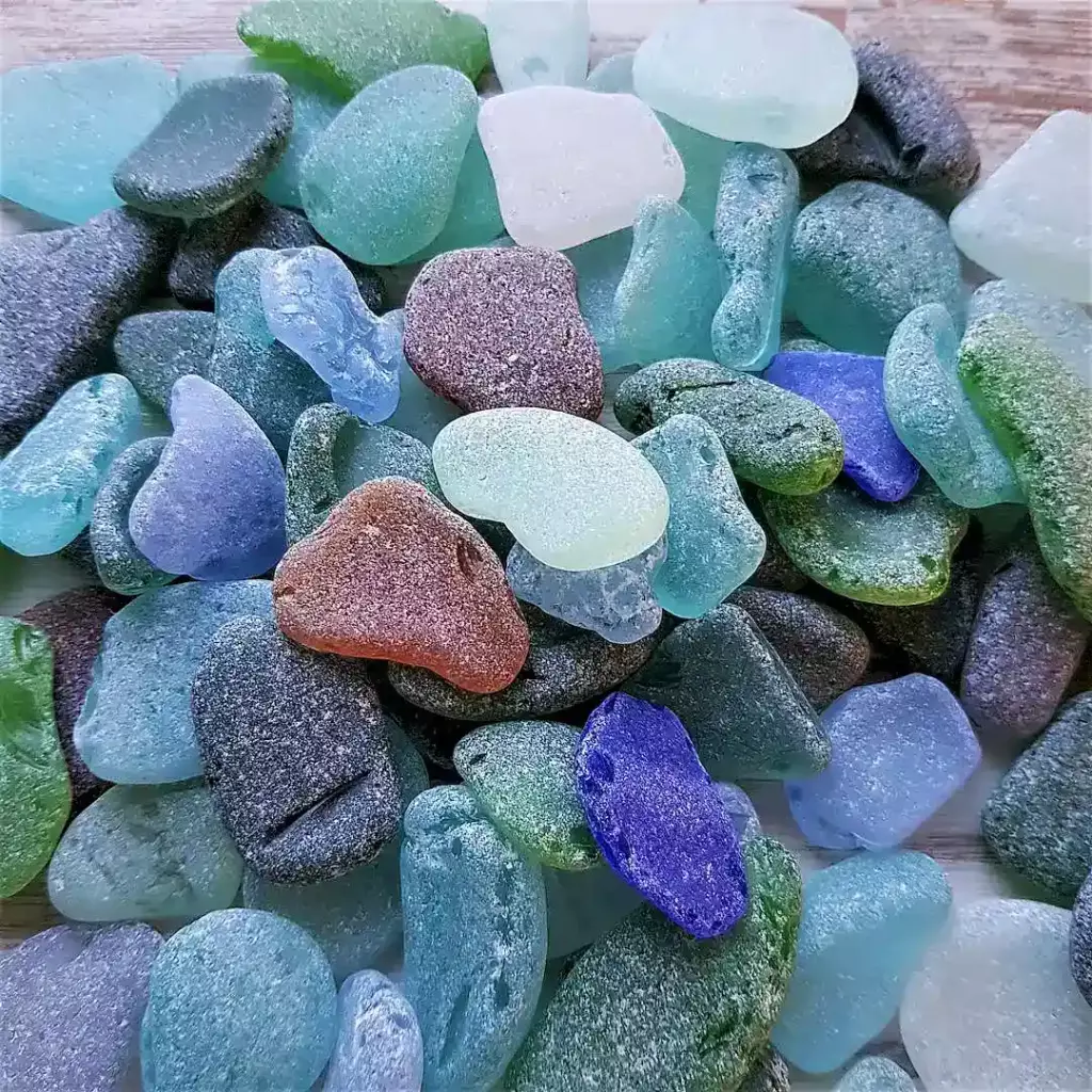 Ocean glass with unique shapes and textures on display.