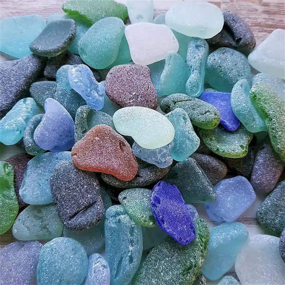 Ocean glass with unique shapes and textures on display.