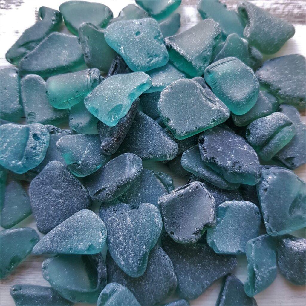 Genuine sea glass in teal hues is available for crafting purposes.