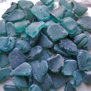 Genuine sea glass in teal hues is available for crafting purposes.