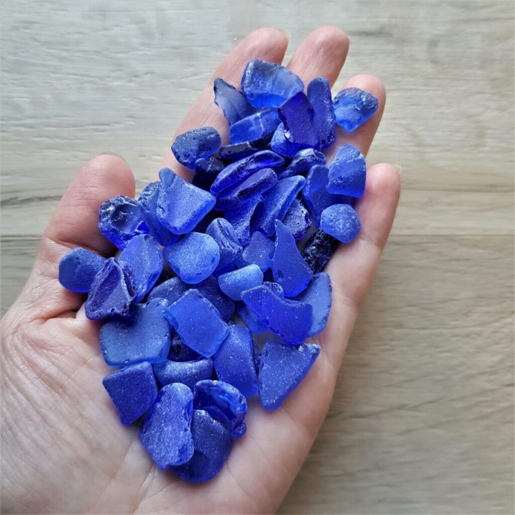 A handfull of small cobalt blue sea glass for decor and beach art