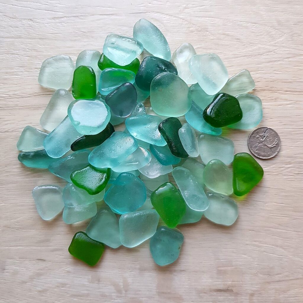 Smooth and frosted real sea glass in sea wave colour