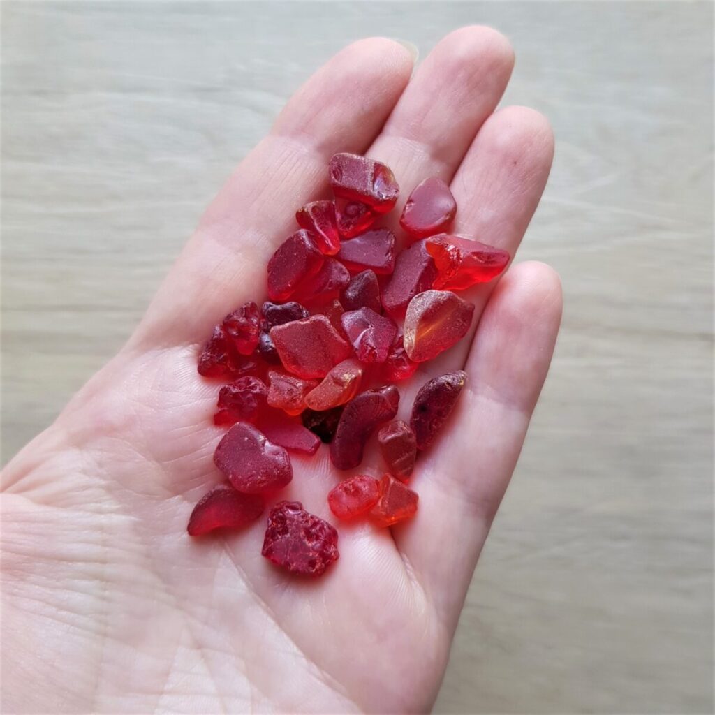 Handful of Tiny Red Sea glass. The unique red Japan Sea glass chips are perfect for craft projects