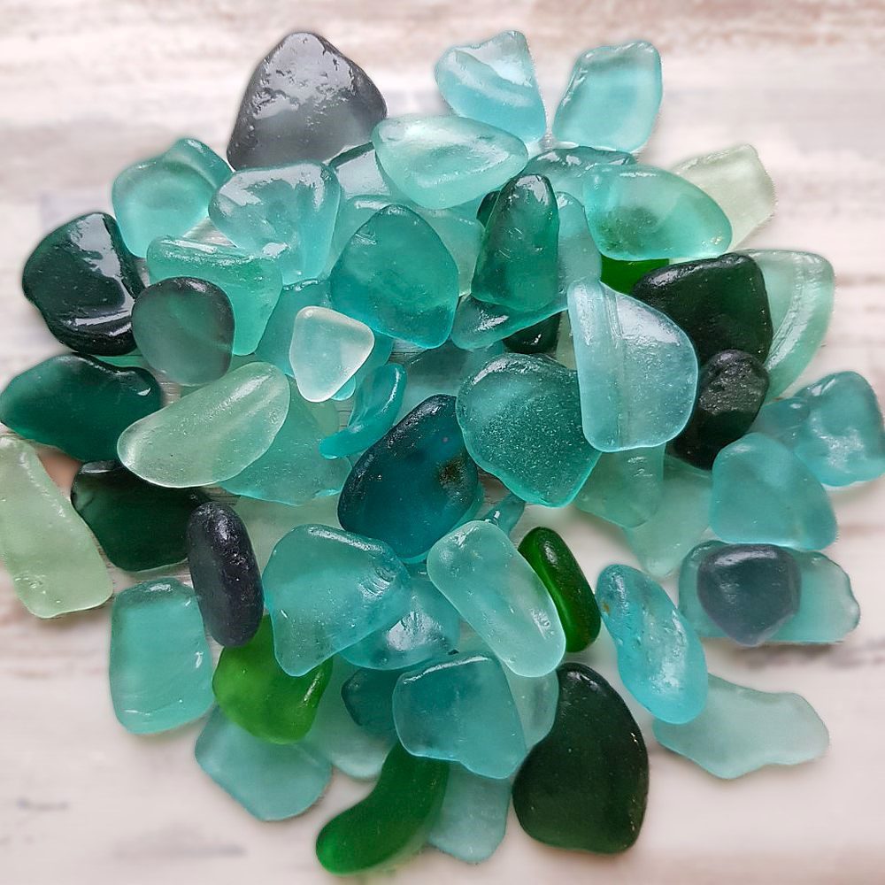 Well-aged wet sea glass in aqua, sea foam, and teal colors.