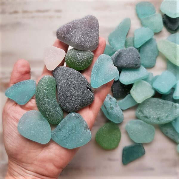 Handful of large and frosty sea glass pieces in aqua, sea foam, gray, green and teal.