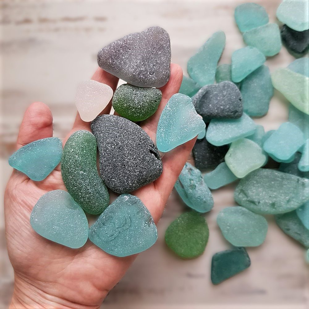 Handful of large and frosty sea glass pieces in aqua, sea foam, gray, green and teal.