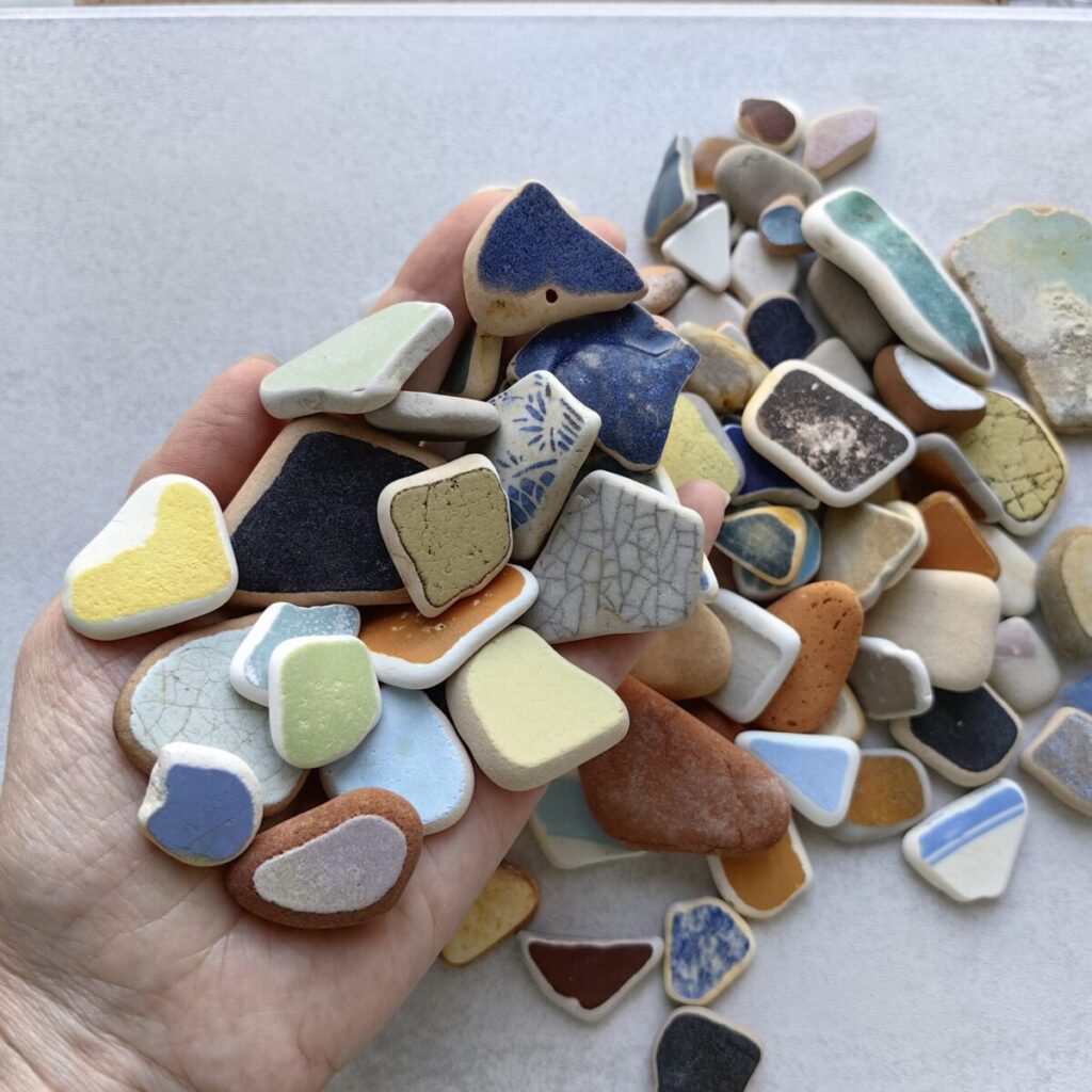 Handful of colored sea pottery