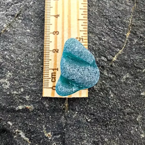Textured Teal Sea Glass on a ruler