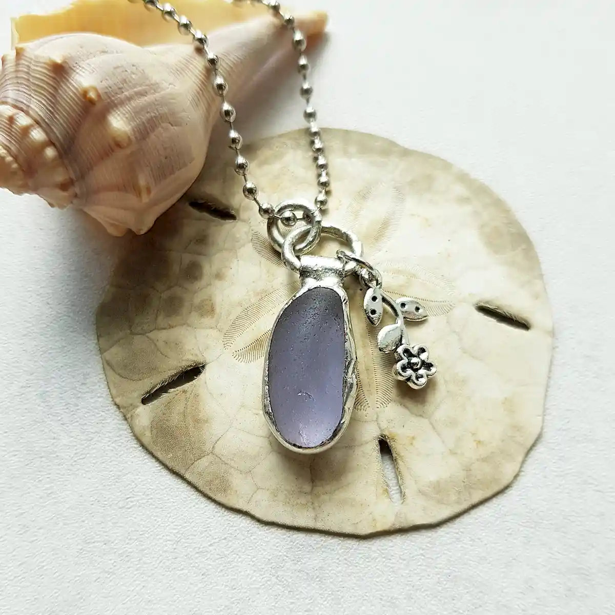 Minimalist grey sea glass necklace with flower charm - Japan sea glass