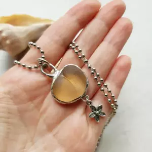 Peach Sea Glass Charm Necklace with flower charm