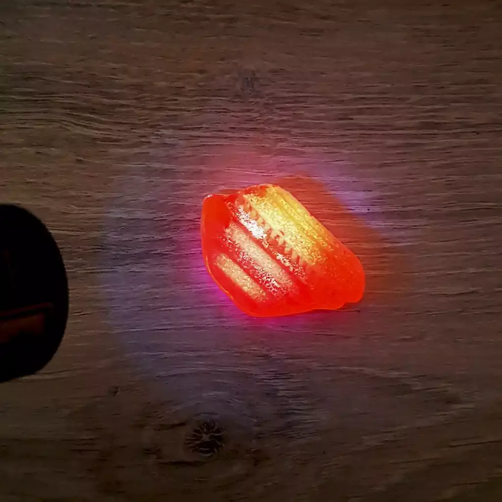 Yellow sea glass under UV light