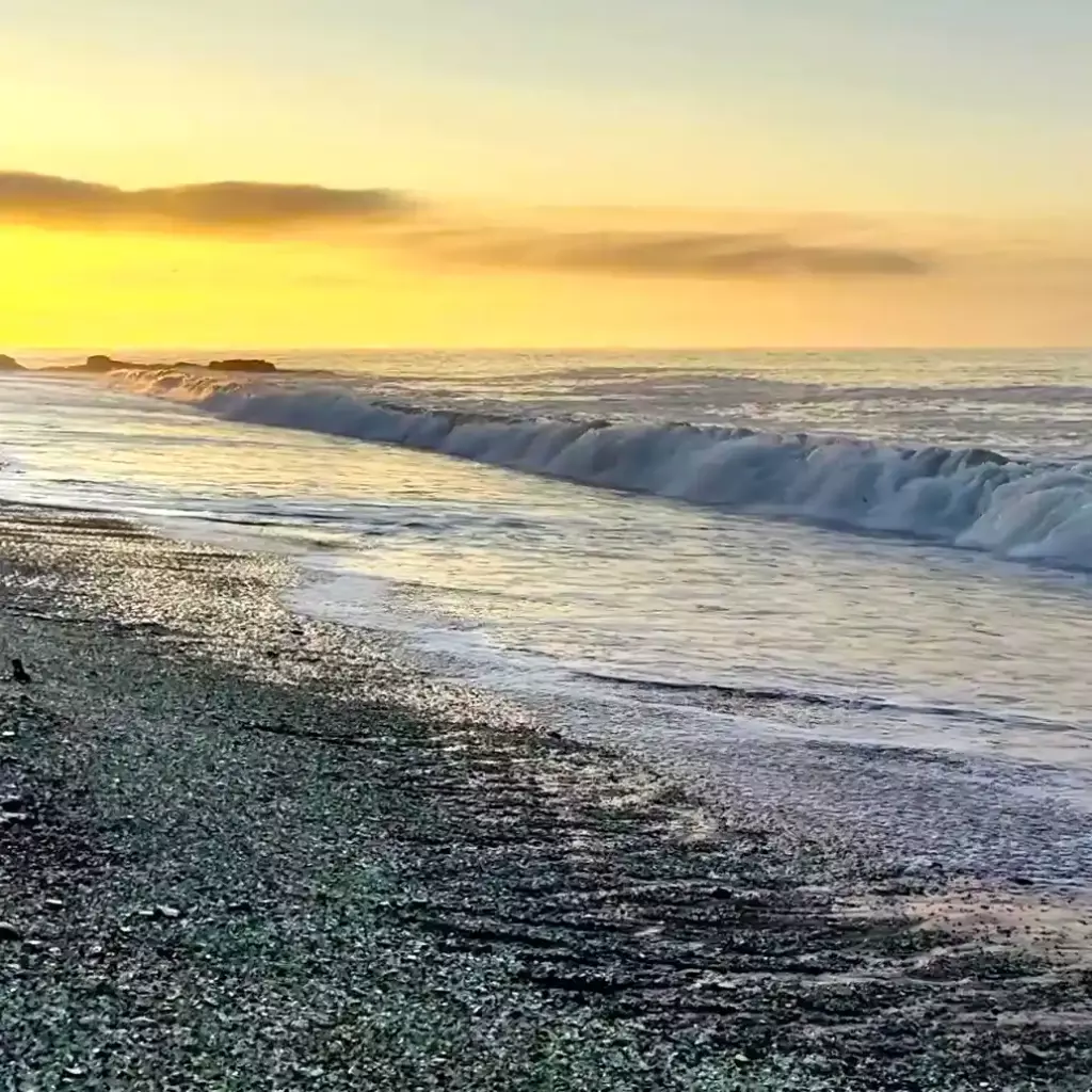 Surf on the Glass Beach. high energy ocean surf zone and gravel sediment slurry.