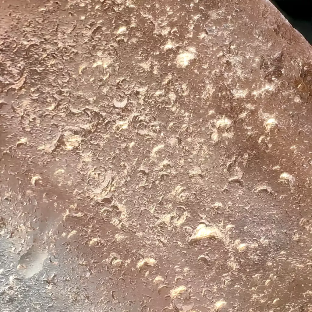 Macro view of genuine pink sea glass with c- marks